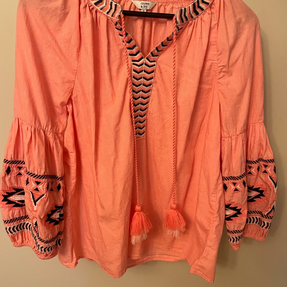 Crown and ivy peasant top with Aztec detail. Coral color
